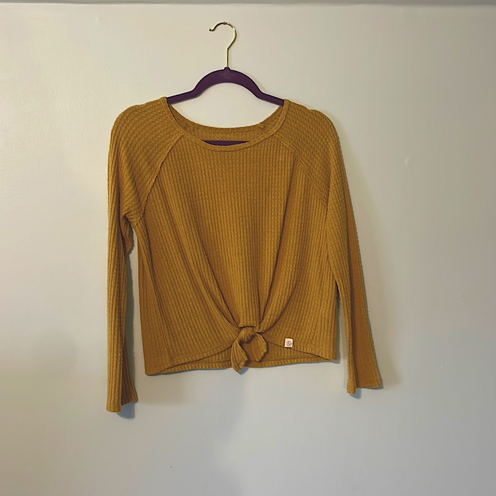 This is a mustard sweater that is in great condition!